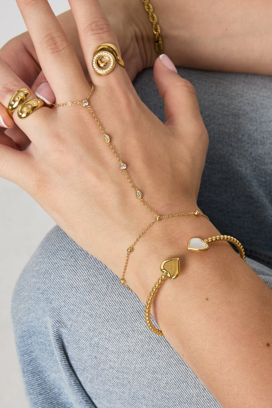 Symmetrically dotted bangle with detailed ends