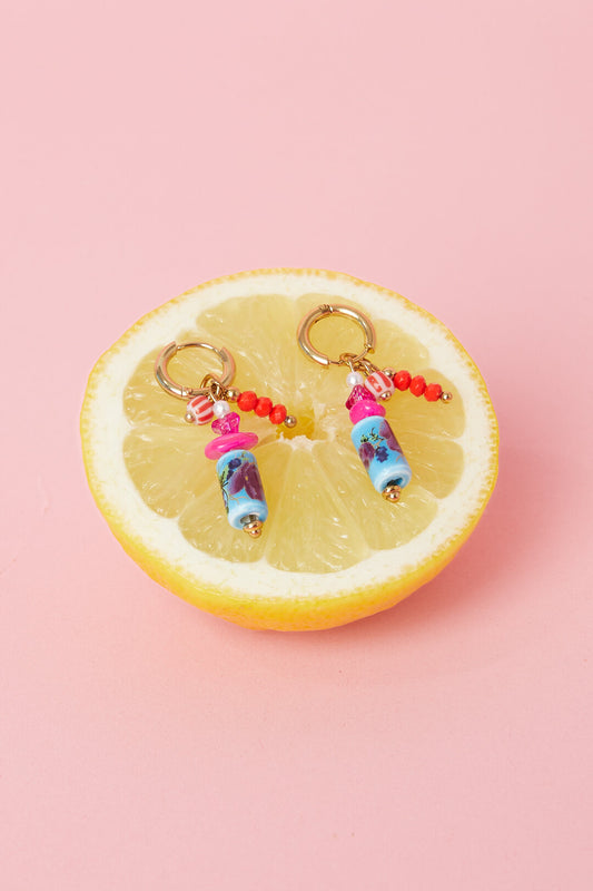 Earrings with dangling beads and a floral print