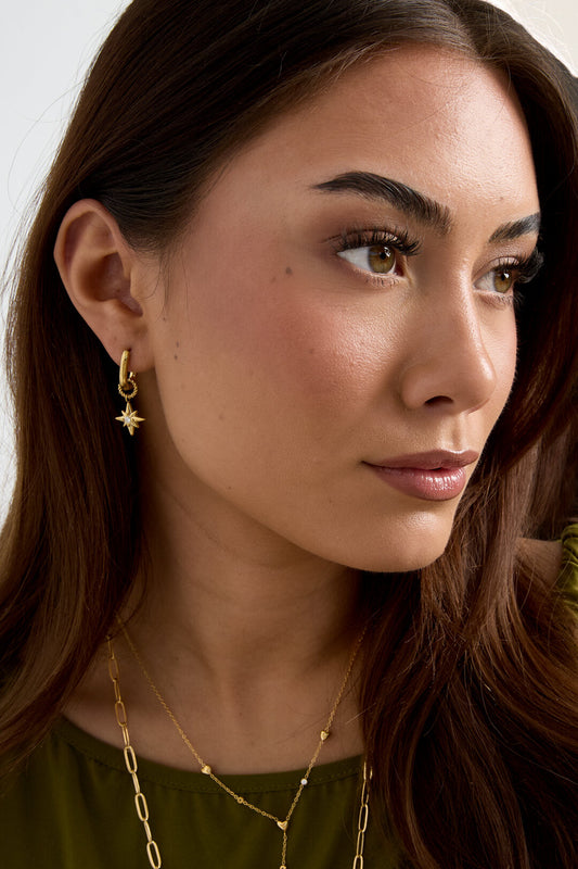 Earrings with shooting star on a small ring