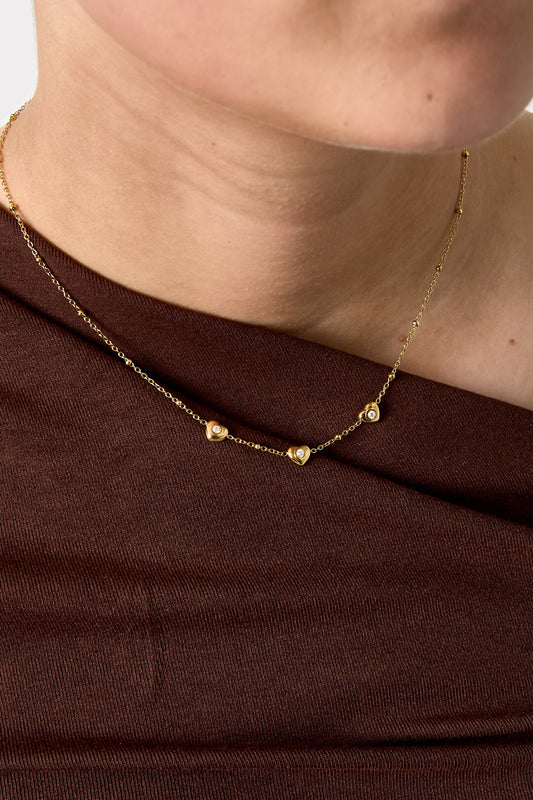 Necklace with beads and hearts with stone