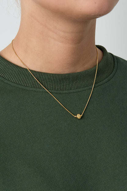 Minimalist necklace with a clover
