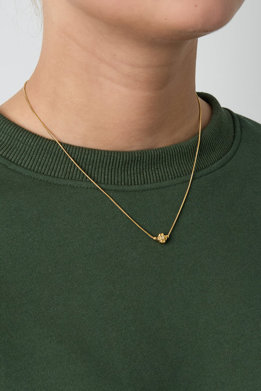 Minimalist necklace with a clover