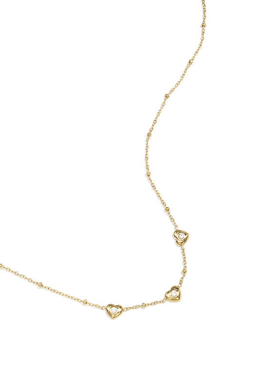 Necklace with beads and hearts with stone