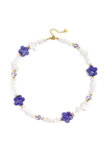 Necklace with stone beads, white beads with blue flowers and statement flowers