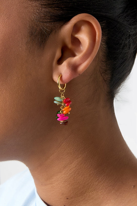 Small hoop earrings with dangling stones and beads
