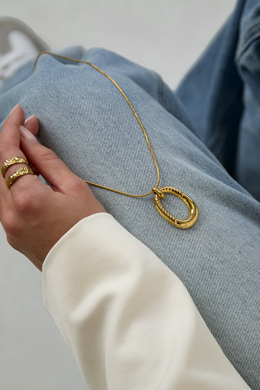 Long necklace with oval striped pendant