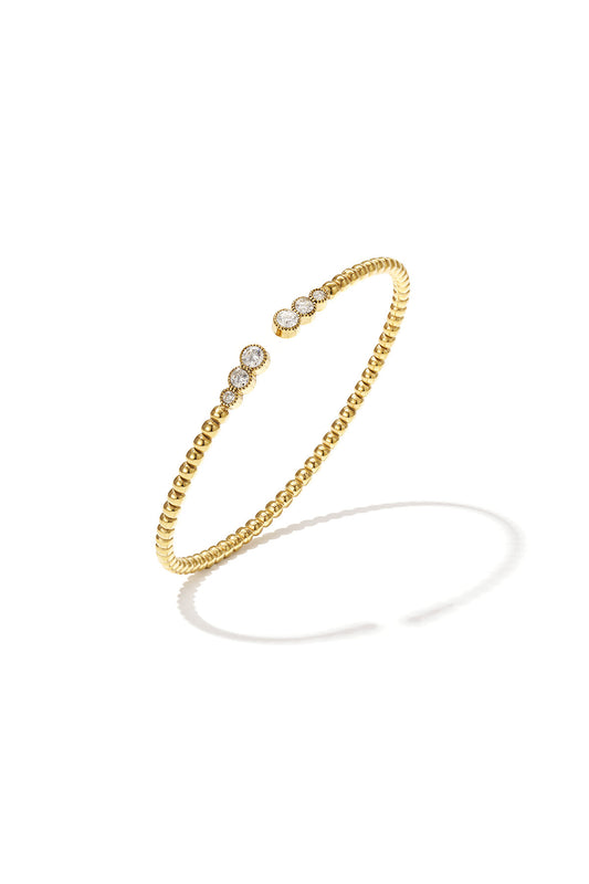 Symmetrically dotted bangle with detailed ends