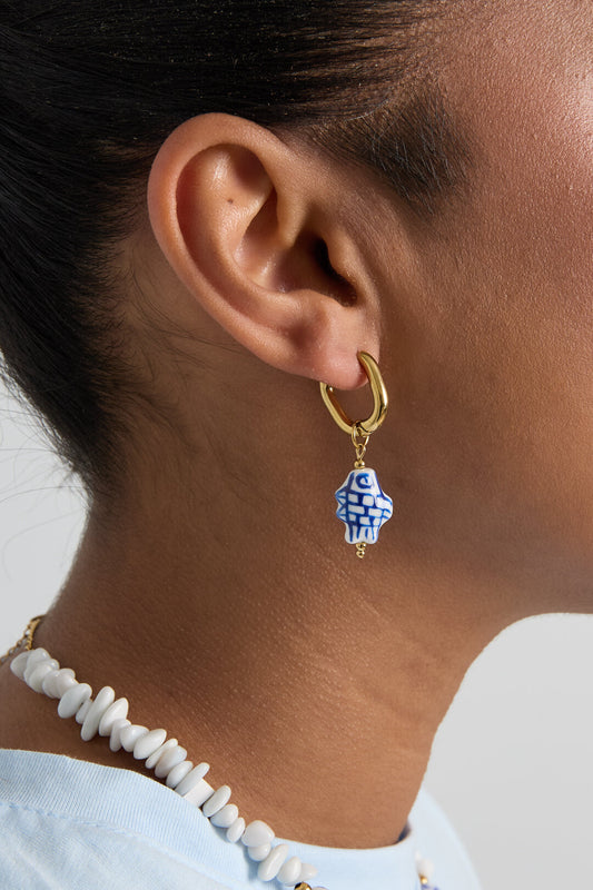 Squoval earrings with checkered fish charm