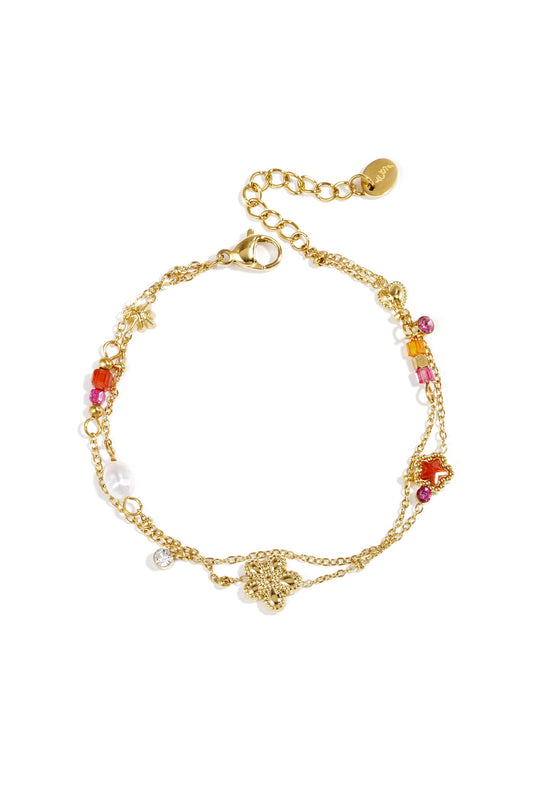 Charm bracelet with star and flower charms, pearls, stones and beads