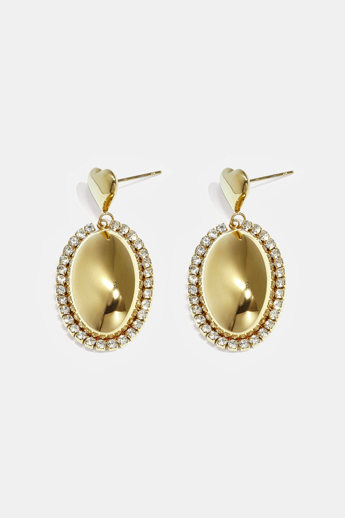 Statement earrings with an oval charm surrounded by stones