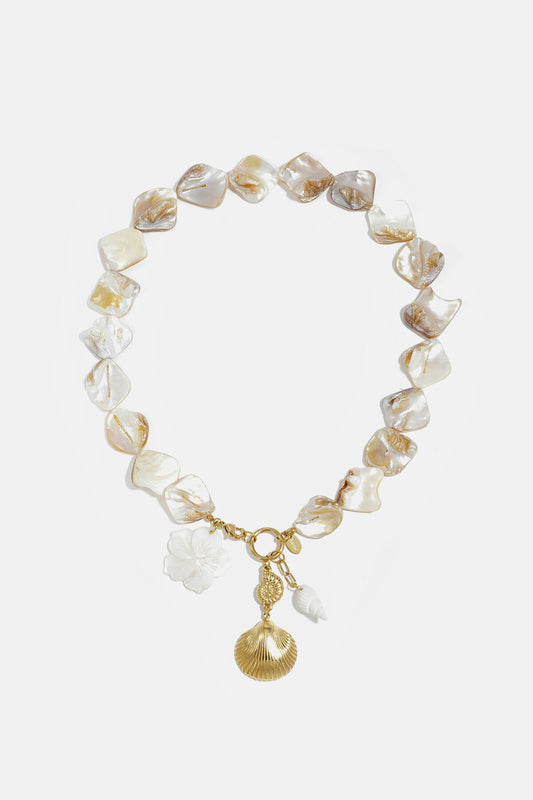 Necklace with beads of seashells, pearls and dangling shells