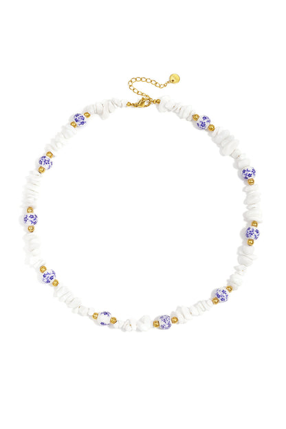 Necklaces with stone beads and white beads with blue flowers